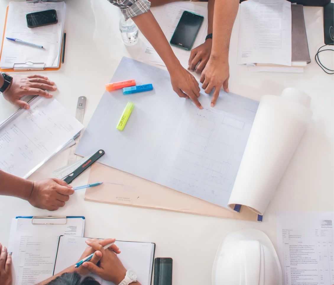 group of people working through the site selection phase of a project.